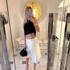 Elizabeth Bennett wearing tailored Bermuda shorts