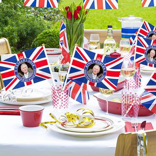 Coronation decorations on a party table with Union Jack flags