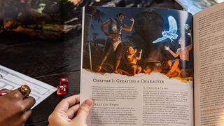 Dungeons & Dragons Essentials Kit promo image with book, dice, and DM screen