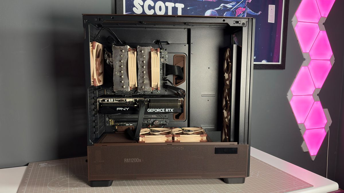 The Antec Flux Pro Noctua Edition on a desk with various parts disassembled.