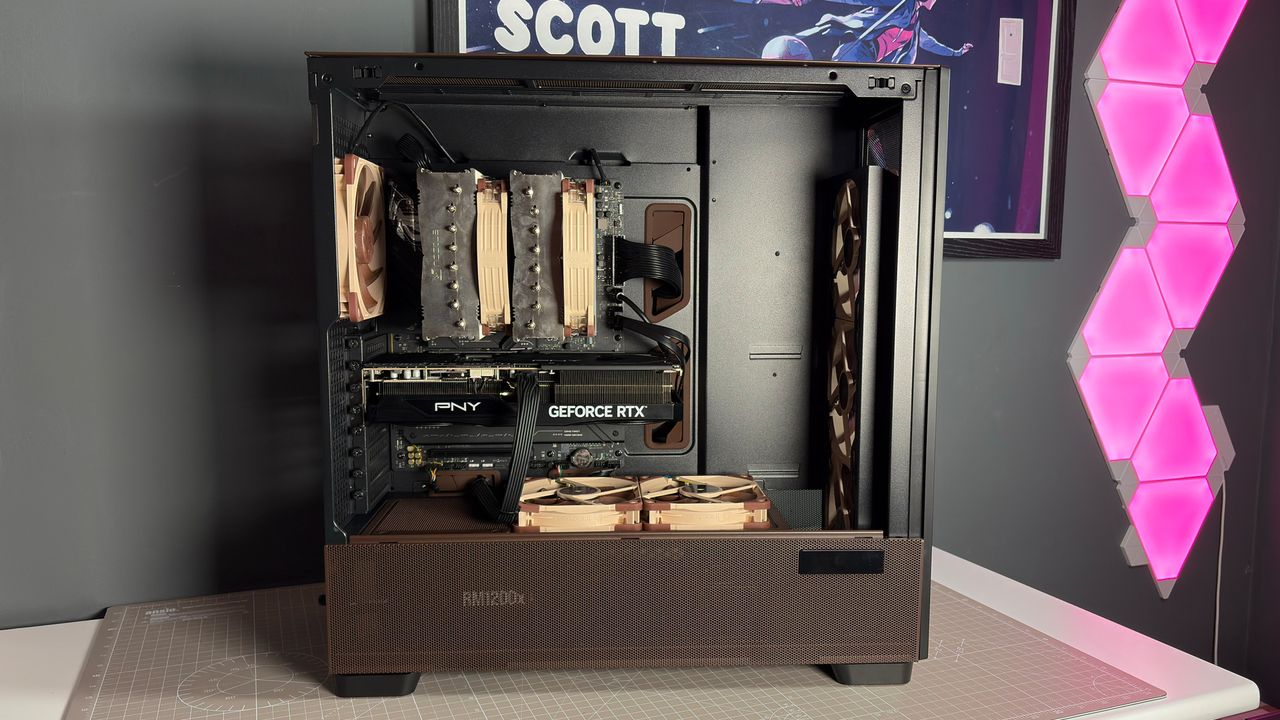 The Antec Flux Pro Noctua Edition on a desk with various parts disassembled.