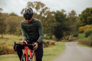 Male cyclist looking at his cycling computer