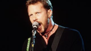 James Hetfield performing onstage with Metallica in 1996