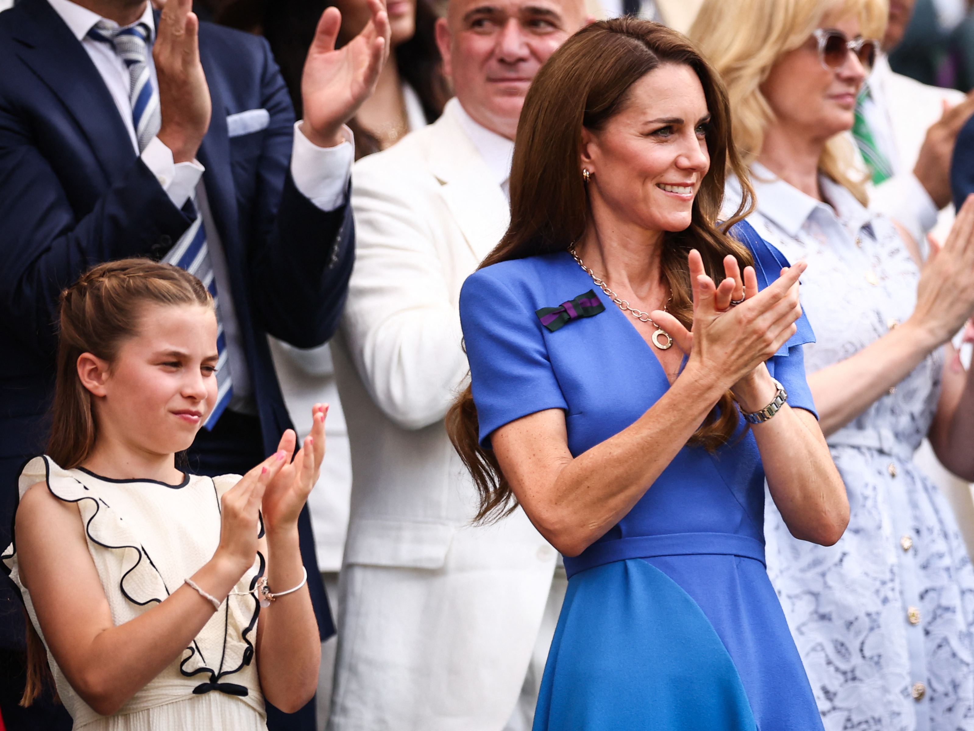 Britain&#039;s Catherine, Princess of Wales (R) and Britain&#039;s Princess Charlotte of Wales applaud on the royal box on Centre Court ahead of the men&#039;s singles final tennis match between Italy&#039;s Jannik Sinner and Spain&#039;s Carlos Alcaraz on the fourteenth day of the 2025 Wimbledon Championships at The All England Lawn Tennis and Croquet Club in Wimbledon, southwest London, on July 13, 2025. (Photo by HENRY NICHOLLS / AFP) / RESTRICTED TO EDITORIAL USE