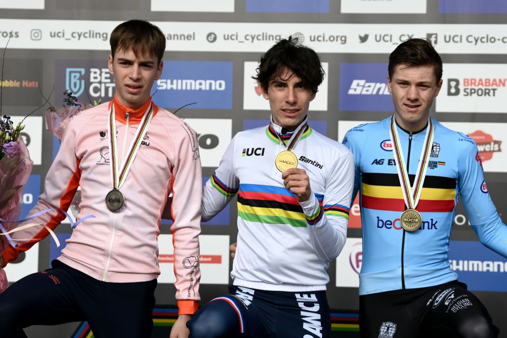 HOOGERHEIDE NETHERLANDS FEBRUARY 05 Silver medalist Senna Remijn of Netherlands gold medalist Lo Bisiaux of France and bronze medalist Yordi Corsus of Belgium pose on the podium during the medal ceremony after the 74th World Championships CycloCross 2023 Mens Junior CXWorldCup Hoogerheide2023 on February 05 2023 in Hoogerheide Netherlands Photo by David StockmanGetty Images