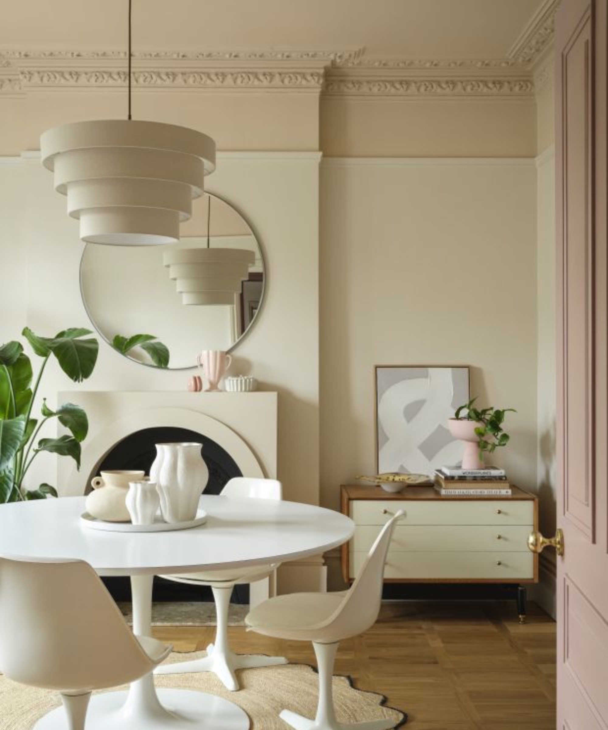 Cream dining room with white tulip dining table and chairs