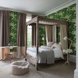bedroom with four poster bed and leafy wallpaper