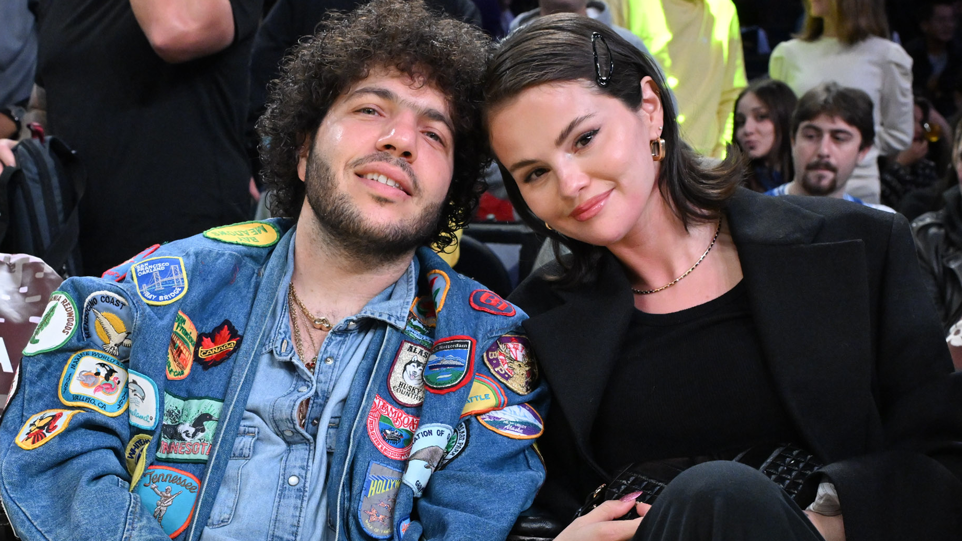 Selena Gomez and Benny Blanco attended a L.A. Lakers game—Selena wore all-black, plus a Versace handbag and knee-high boots