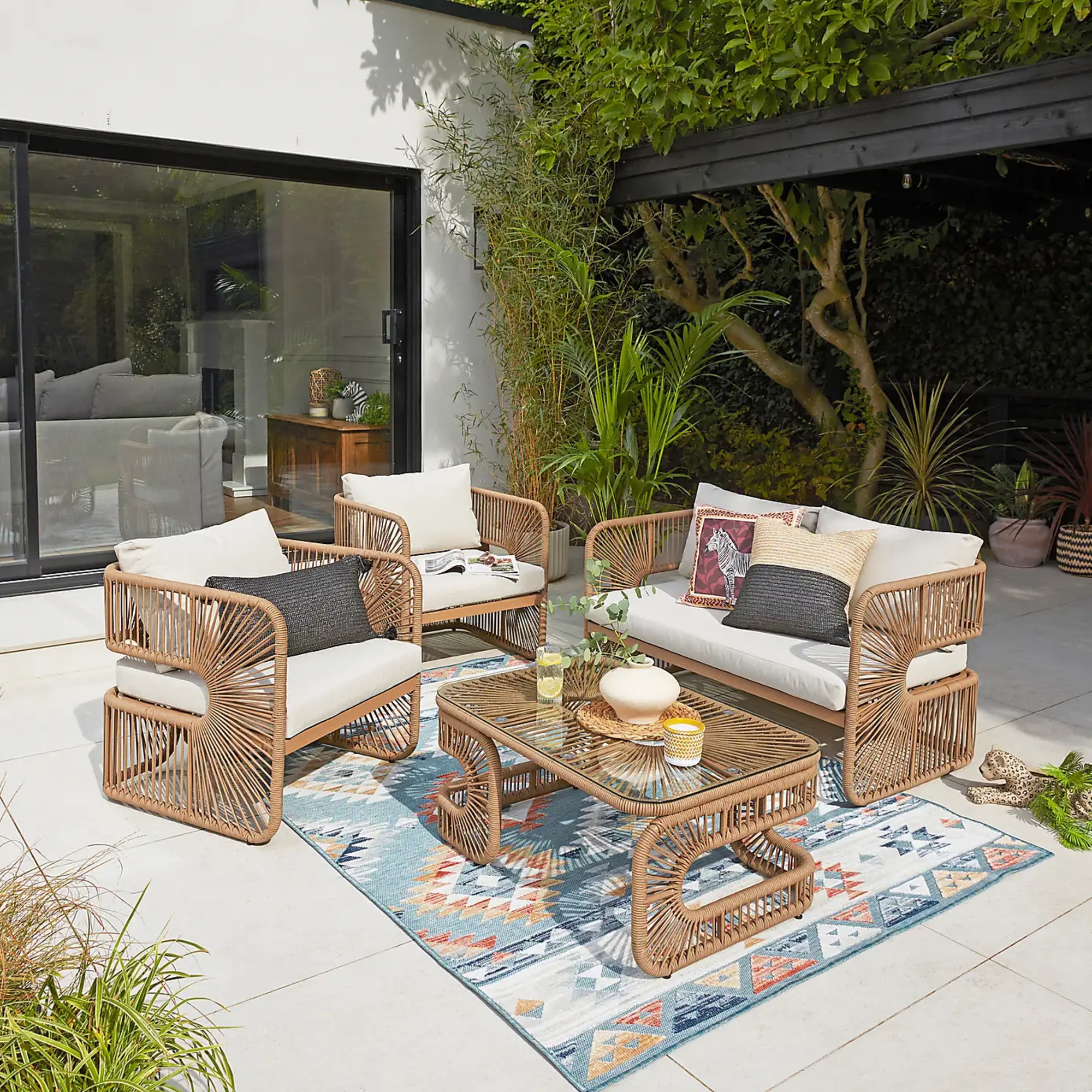 Dunelm Amazonia 4 Seater Conversation Set on top of an outdoor rug on a patio