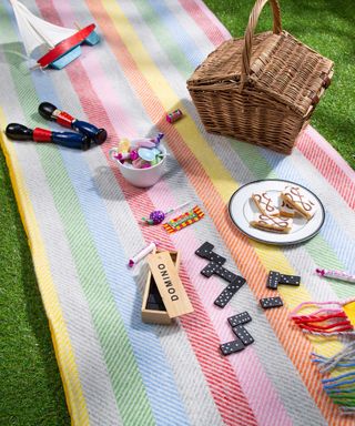 colorful picnic rug from heating & plumbing london with outdoor games