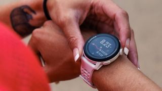 Woman using Coros Pace 3 GPS watch