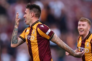 Andy Cook of Bradford City celebrates after scoring a goal to make it 2-1 during the Carabao Cup First Round match between Bradford City and Hull City at Northern Commercials Stadium on August 9, 2022 in Bradford, England.