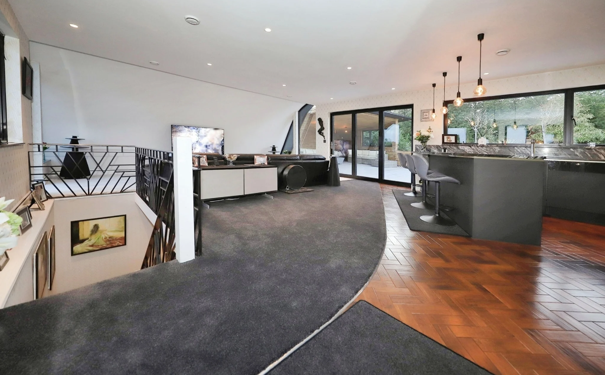 A kitchen-dining area leading to an outdoor patio area