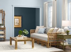 A blue living room with rattan furniture 