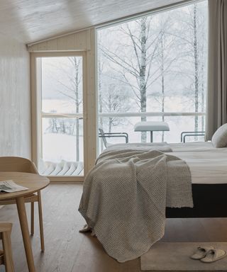 Large windows and bed in Uni Villa in Finland