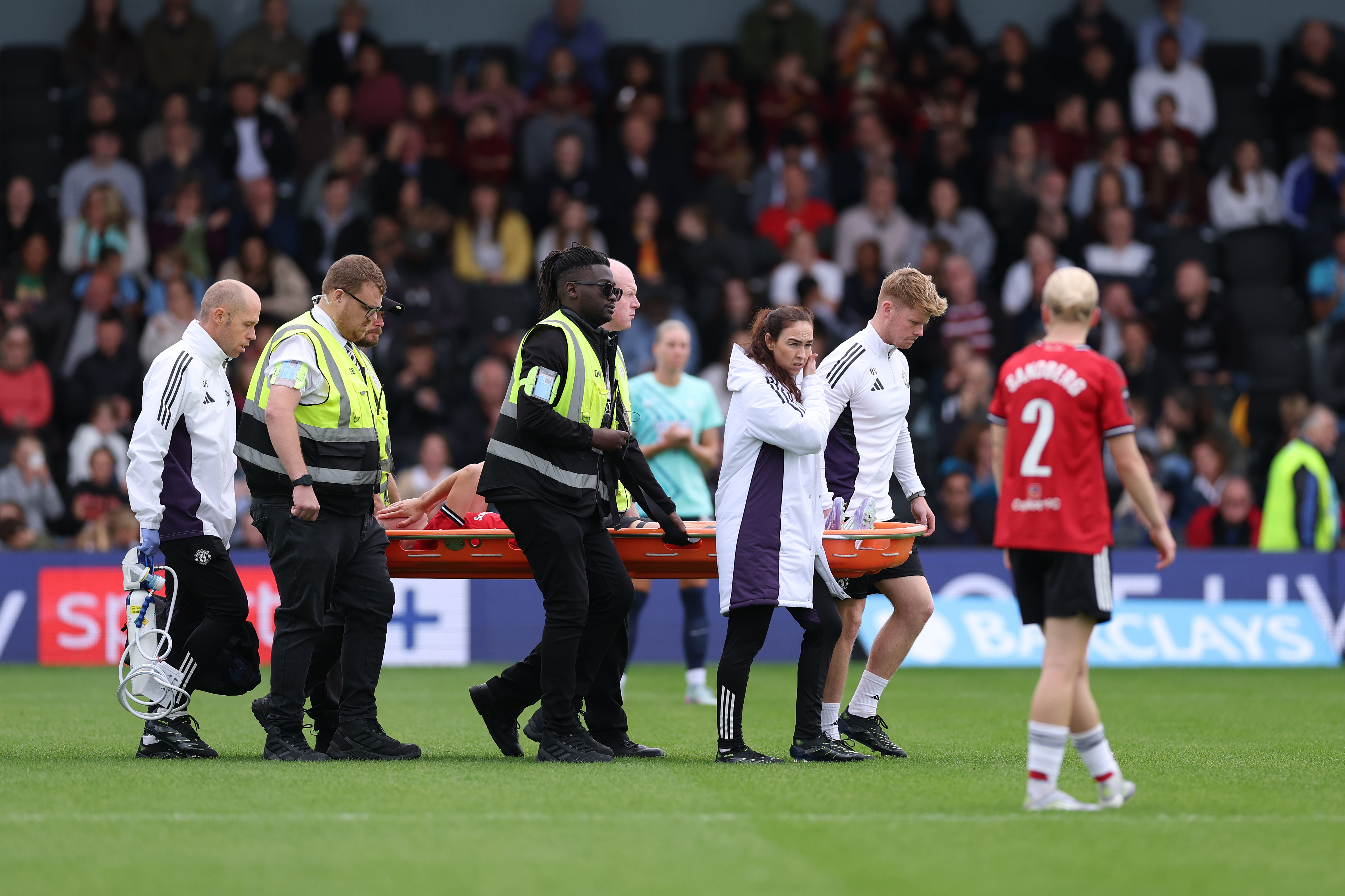 Man United Women defender Millie Turner was stretchered off against London City Lionesses