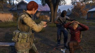 Two survivors hold a person hostage at gunpoint.
