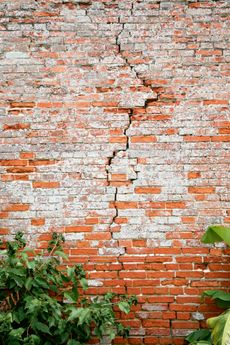 Cracked exterior brick wall