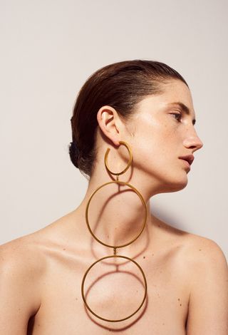 Woman with large circular earrings