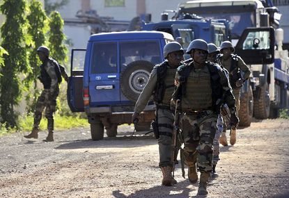 Malian troops outside the Radisson Blu hotel