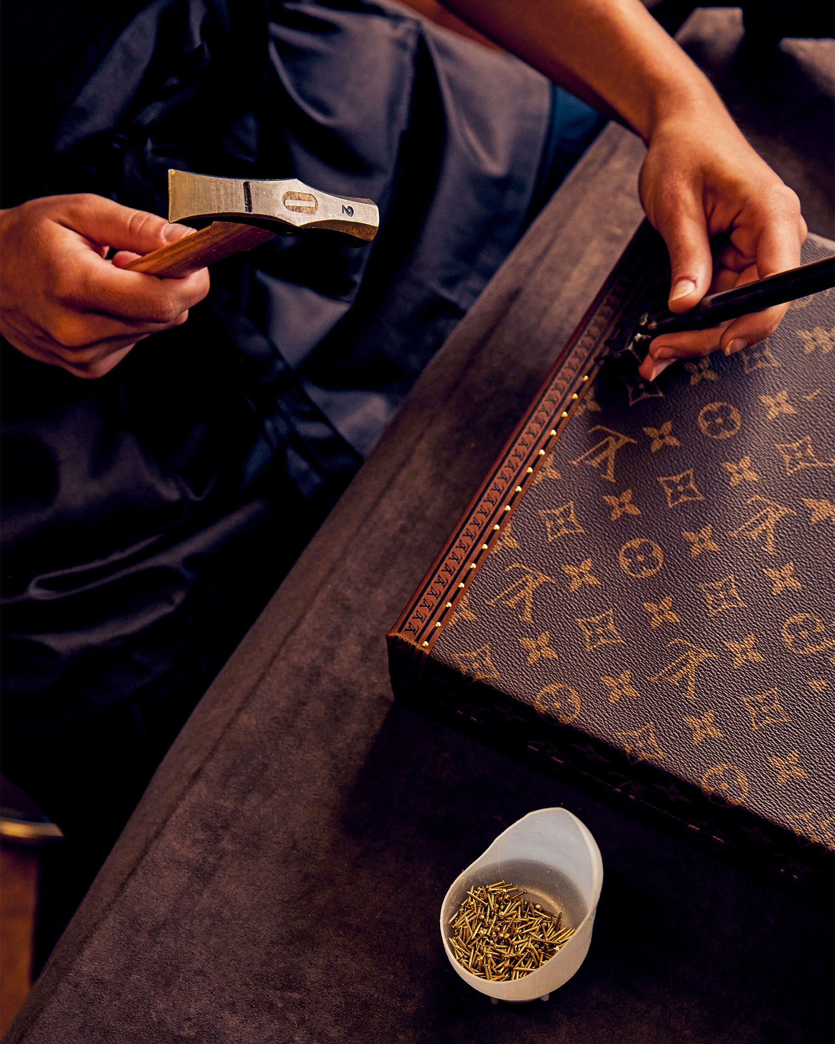 artisan making Louis Vuitton bag