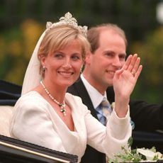 Duchess Sophie and Edward on their wedding day waving in a carriage