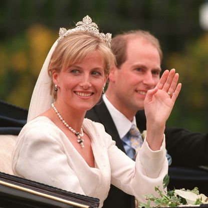 Duchess Sophie and Edward on their wedding day waving in a carriage