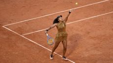 Naomi Osaka serves in her loss to Aryna Sabalenka
