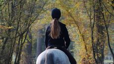 Lady riding in inexpensive riding hat