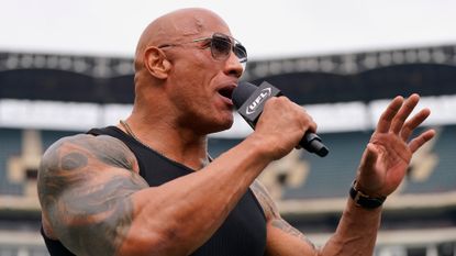 The Rock reacts prior to a game between the Birmingham Stallions and Arlington Renegades at Choctaw Stadium on March 30, 2024 in Arlington, Texas.