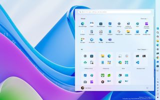 Windows 11 desktop with colorful wave background. A Start menu overlay shows pinned apps like Microsoft Edge and Teams, organized by category in a grid layout.
