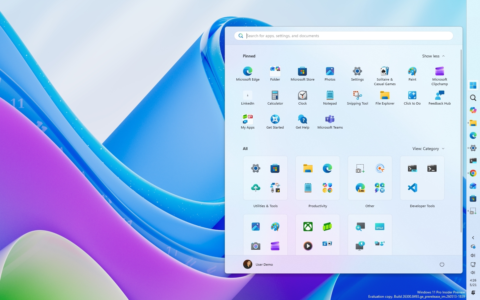 Windows 11 desktop with colorful wave background. A Start menu overlay shows pinned apps like Microsoft Edge and Teams, organized by category in a grid layout.