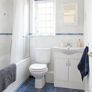 bathroom with classic blue and white tiles and sink