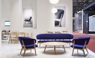 Blue seating with wooden frames and coffee table