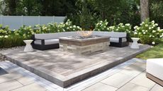 patio with central fire pit and white hydrangeas