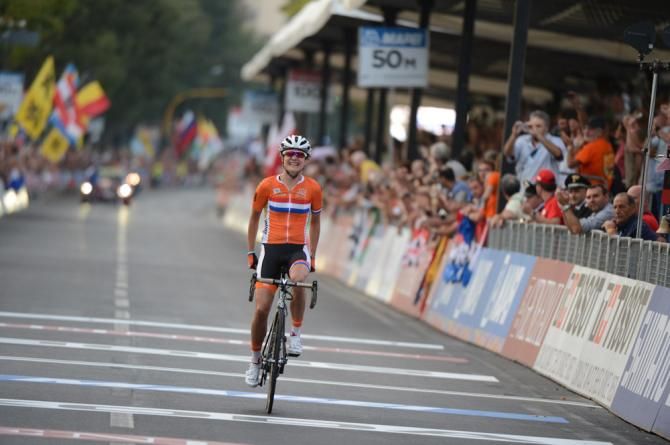 Marianne Vos (Netherlands) finishes alone on the streets of Florence, Italy for the third road world title of her illustrious career.