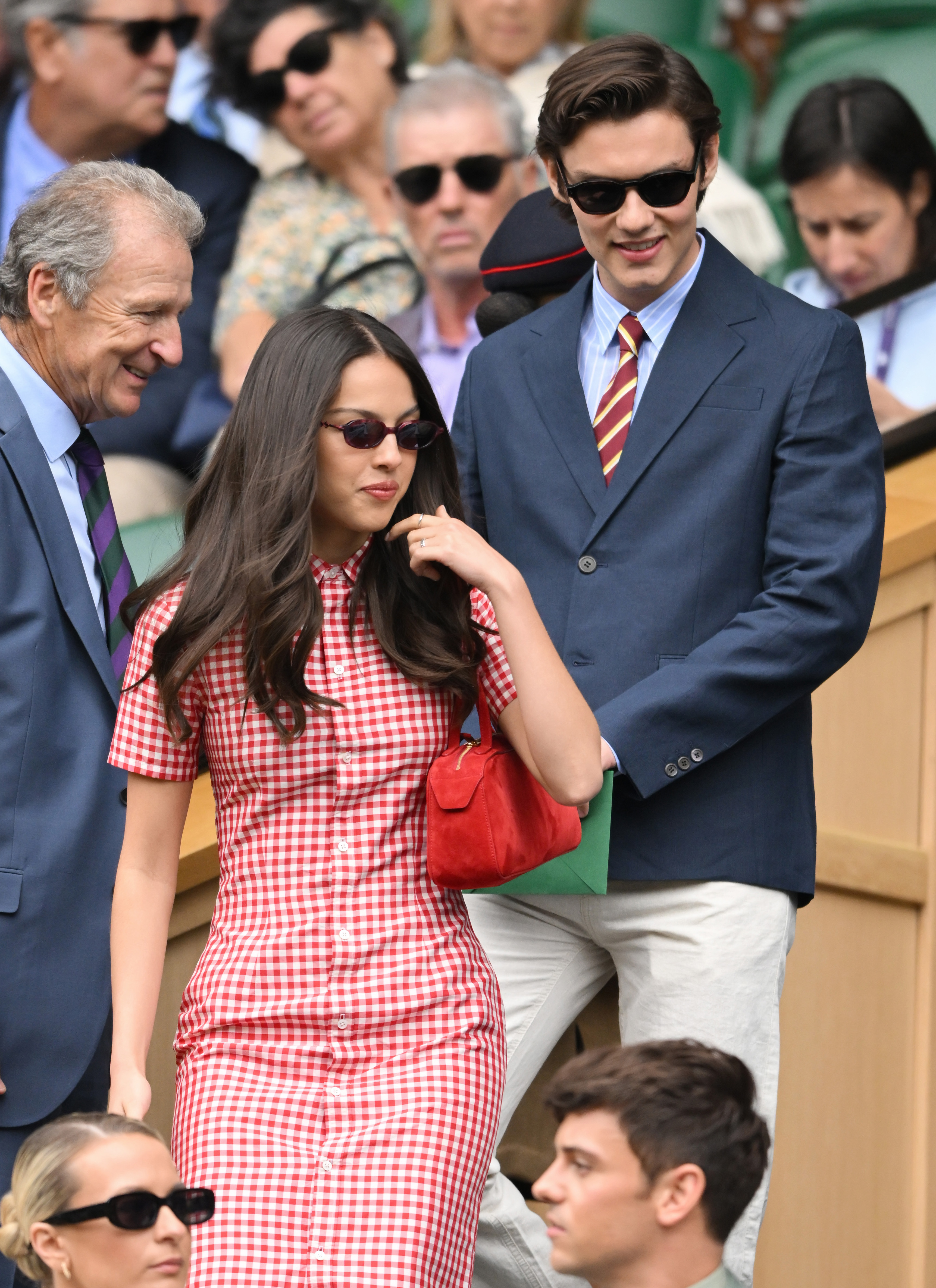 Olivia Rodrigo and boyfriend Louis Partridge attended Wimbledon 2025 in a red gingham mini dress.