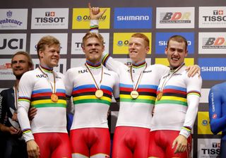 Winners Denmarks Lasse Norman Hansen Julius Johansen Frederik Rodenberg Madsen and Rasmus Pedersen pose with their medals on the podium after the mens Team Pursuit Finals at the UCI track cycling World Championship at the velodrome in Berlin on February 27 2020 Photo by Odd ANDERSEN AFP Photo by ODD ANDERSENAFP via Getty Images