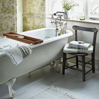 bathroom with green wallpaper