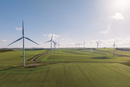 Drone view of a wind farm. Multiple wind turbines