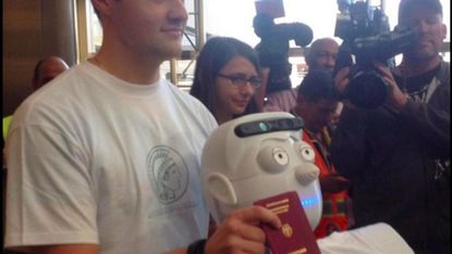 This is the first robot to buy a ticket, fly on a commercial airplane