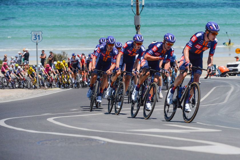 Team Picnic PostNL leads the peloton along the coast during stage 5 of the Tour Down Under cycling race in Adelaide on January 25, 2025. (Photo by Brenton Edwards / AFP)