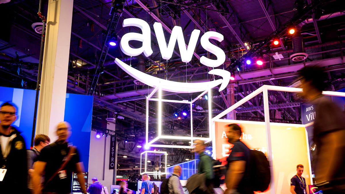 Attendees walk through an expo hall during AWS re:Invent 2022.