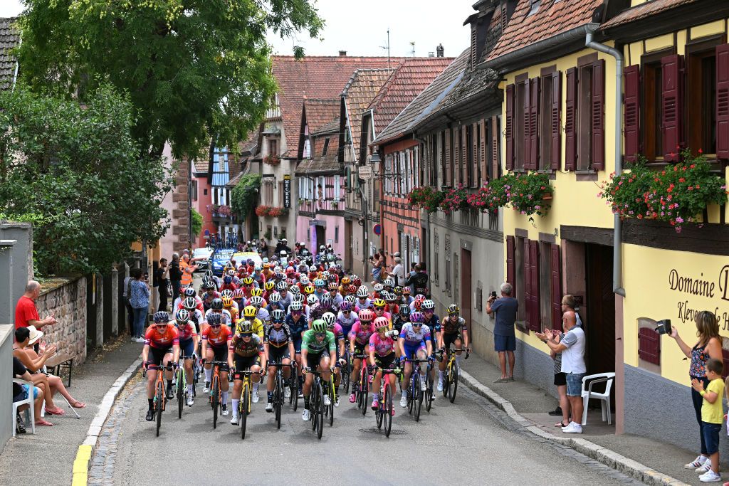 ROSHEIM FRANCE JULY 29 Marianne Vos of Netherlands and Jumbo Visma Women Team Yellow Leader Jersey Veronica Ewers of United States and Team EF Education Tibco Svb Lorena Wiebes of Netherlands and Team DSM Women Green Points Jersey and a general view of the peloton passing through Heiligenstein Village during the 1st Tour de France Femmes 2022 Stage 6 a 1286km stage from SaintDidesVosges to Rosheim TDFF UCIWWT on July 29 2022 in Rosheim France Photo by Dario BelingheriGetty Images