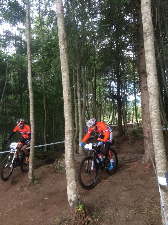 Two Dutch riders race each other through competing lines