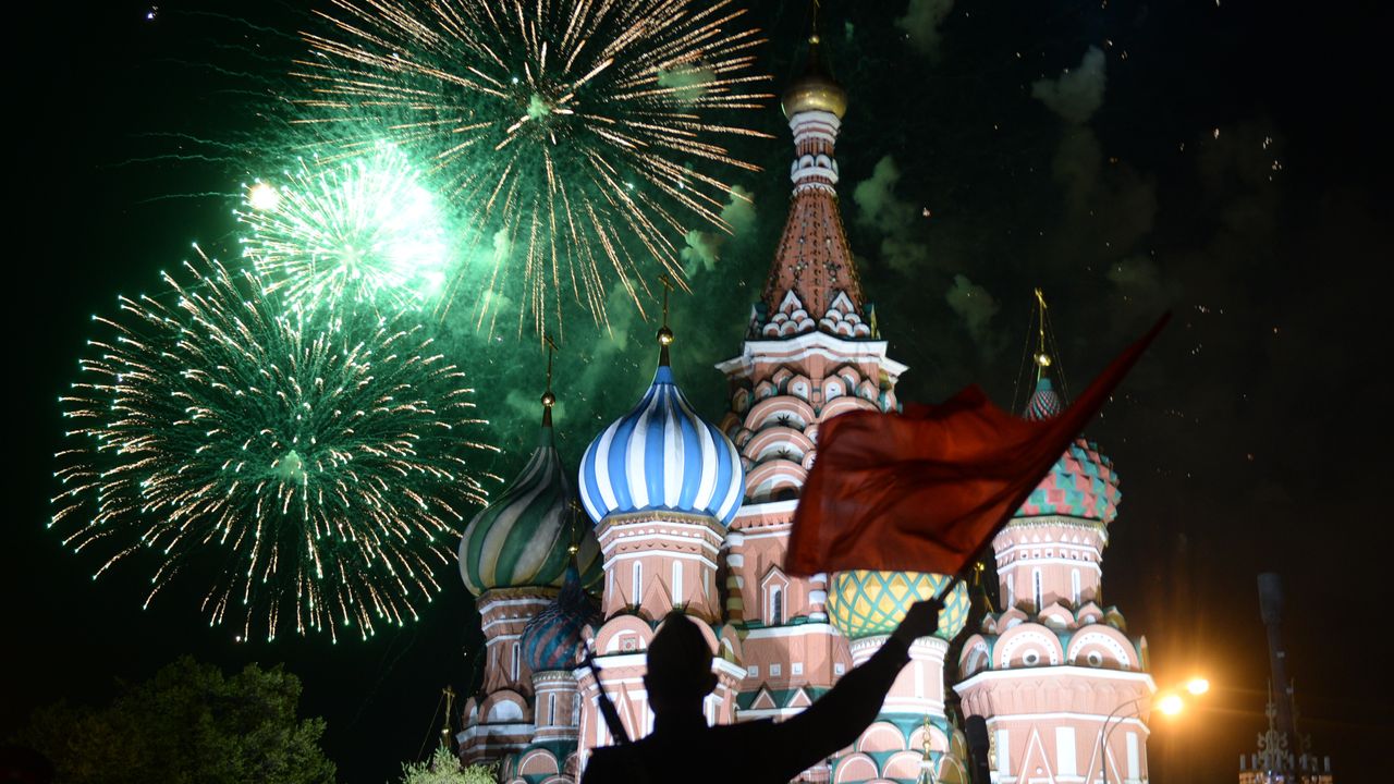 A soldier waves a flag during the Victory Day parade in 2015