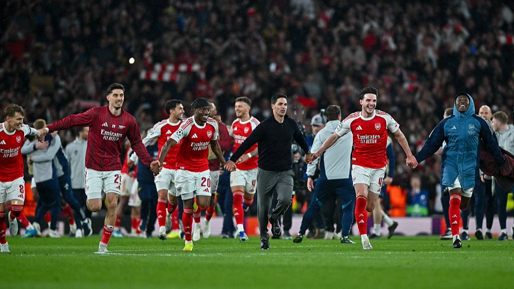 Arsenal players celebrate in a line after reaching the Champions League Final 2026
