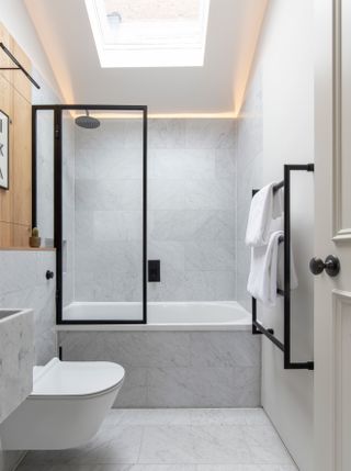 White bathroom with black shower