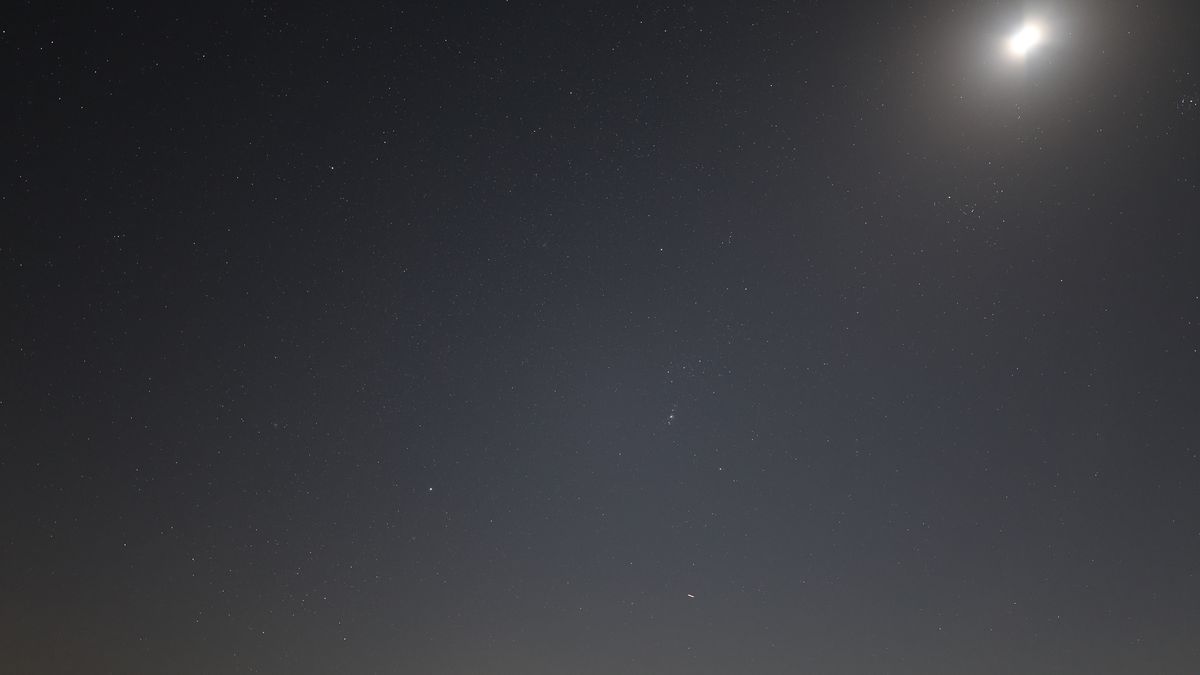 Orion and the moon in the starry night sky photographed with the Canon EOS R5 II and Canon RF 20mm f/1.4 L VCM lens.