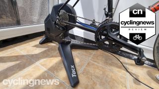 A close up of the Tacx Flux smart trainer with a bike fitted
